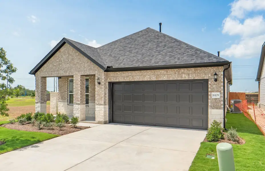 Front exterior of a new home in Kuempel Farms, Pflugerville, TX, highlighting curb appeal (Image 21).