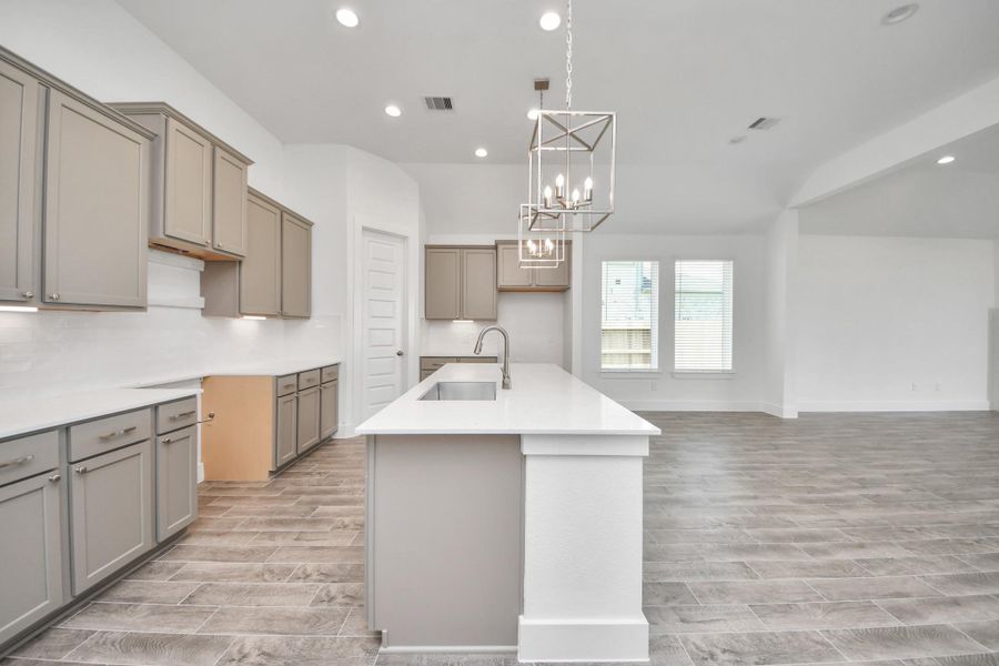 The extended counter area adds both practicality and style, making meal preparation a breeze. Every detail is thoughtfully designed to enhance the kitchen's functionality and aesthetic appeal.