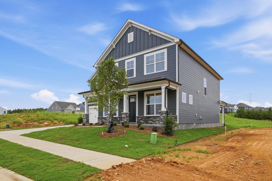 Front exterior of a new home in The Enclave at Laurelbrook, Sherrills Ford, NC, highlighting curb appeal (Image 2).