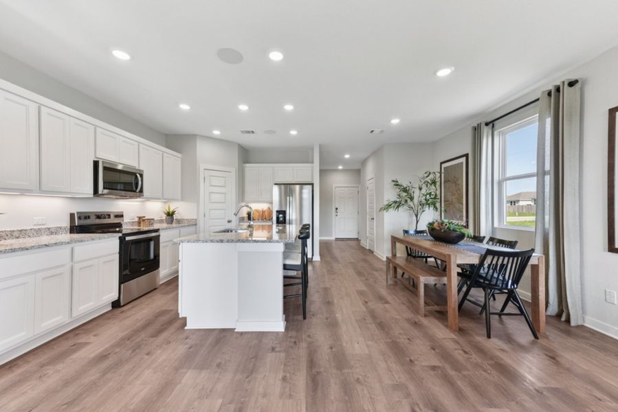 A kitchen with white cabinets. A kitchen with white cabinets.