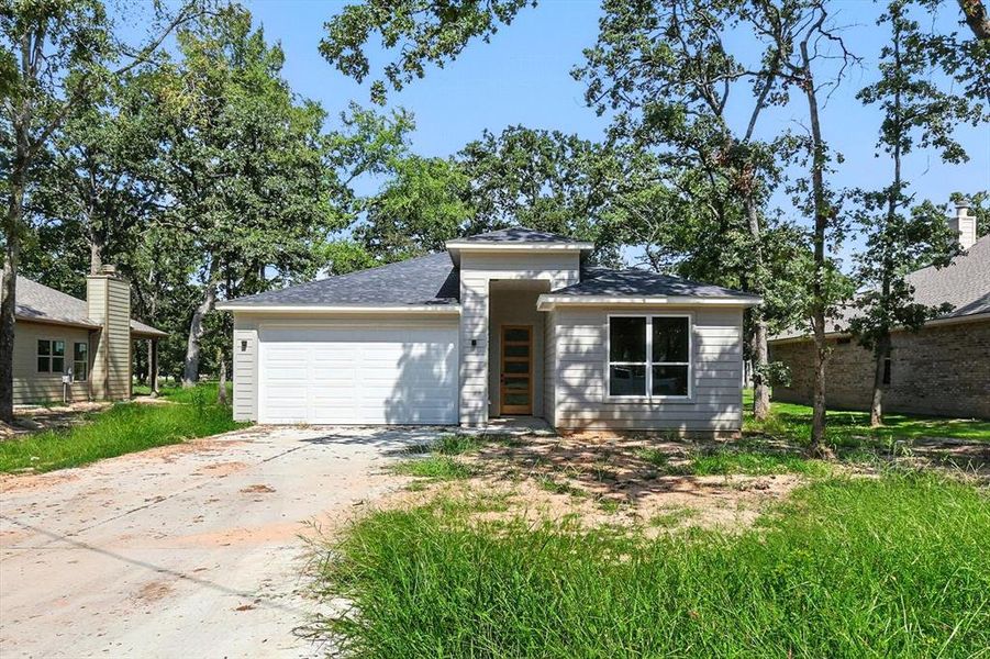 Front exterior of a new home in , Star Harbor, TX, highlighting curb appeal (Image 14). Front exterior of a new home in , Star Harbor, TX, highlighting curb appeal (Image 14).