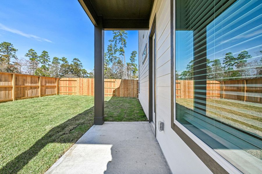 Exterior details and patio area of a home in Pinewood Trails - Luxe Series, Houston (Image 26).