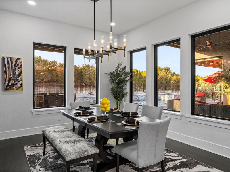 Dining room with hardwood / wood-style floors and hanging lights