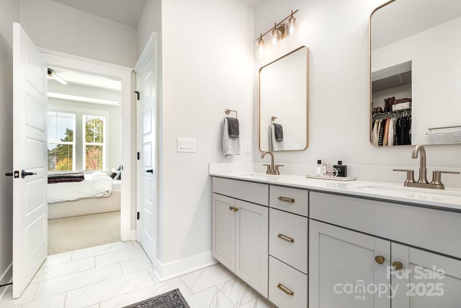 Double Vanity with lots of storage. Separate toilet room, inen closet and large primary closet.