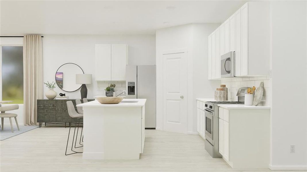 Kitchen with white cabinetry, appliances with stainless steel finishes, a kitchen island, backsplash, and a breakfast bar area Kitchen with white cabinetry, appliances with stainless steel finishes, a kitchen island, backsplash, and a breakfast bar area