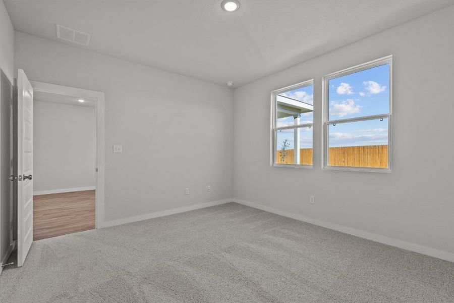 A room with a window and a door.