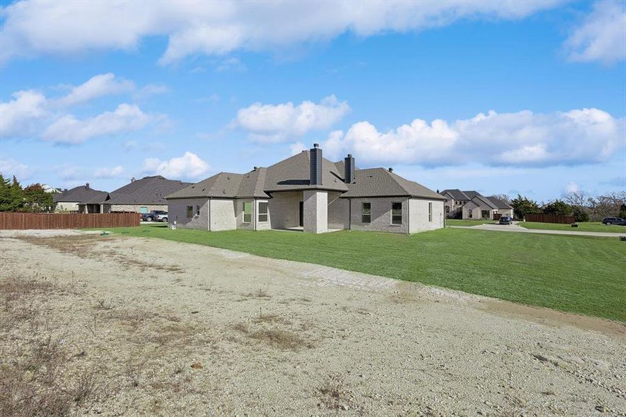 Front exterior of a new home in Oak Creek Ranch, Midlothian, TX, highlighting curb appeal (Image 2).