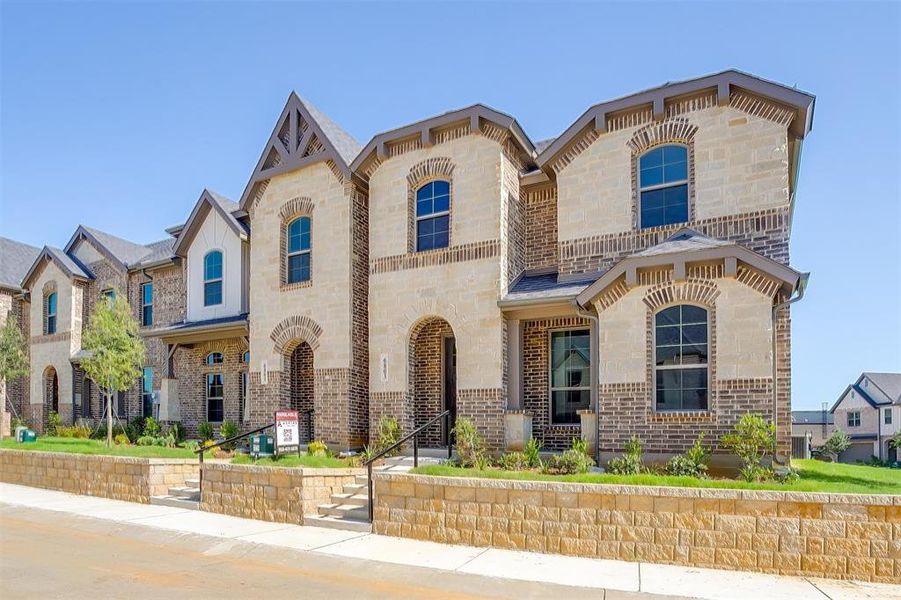 French country style house with brick siding and stone siding French country style house with brick siding and stone siding