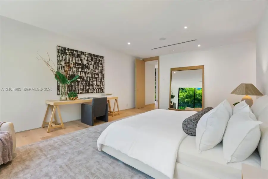 Interior space featuring wood-finish flooring, recessed lighting, and a neutral color palette