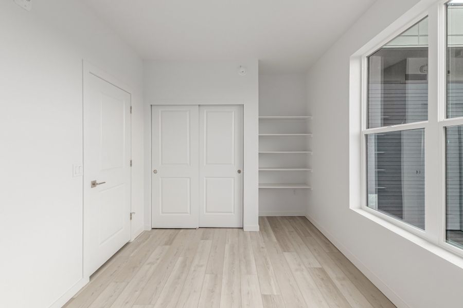 Spacious, unfurnished interior of a new home in The Scene at Sloan's Lake, Denver (Image 7).