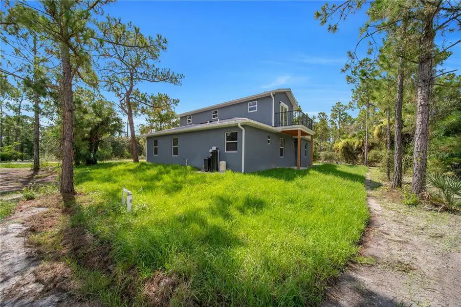 Exterior details and patio area of a home in , Lehigh Acres (Image 3).