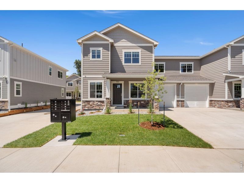 Front exterior of a new home in , Loveland, CO, highlighting curb appeal (Image 2). Front exterior of a new home in , Loveland, CO, highlighting curb appeal (Image 2).