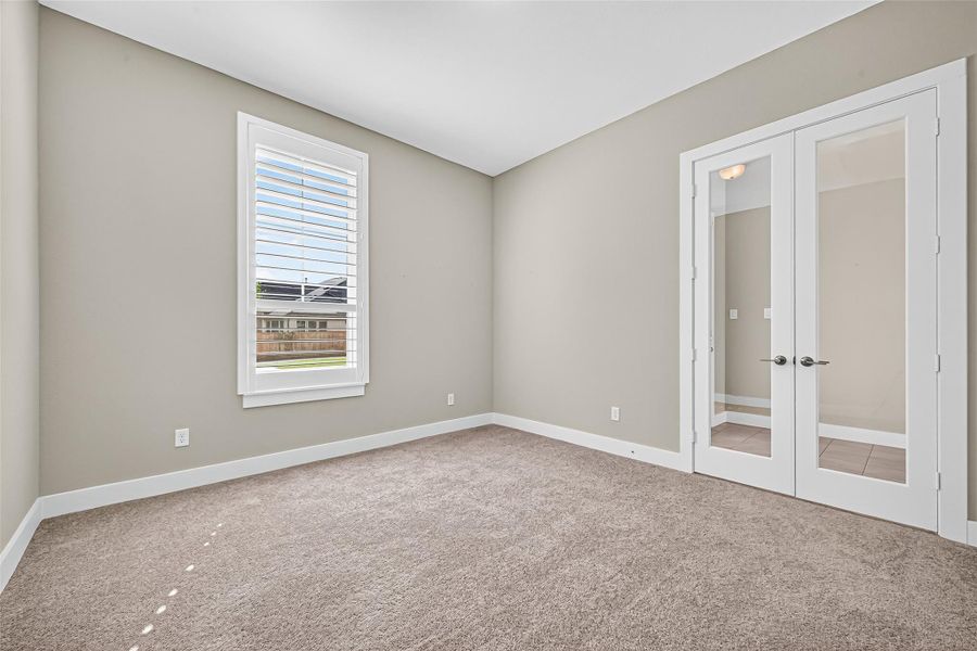 Home office with french doors for privacy when needed.
