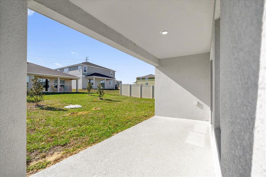 Exterior details and patio area of a home in Landings at Lake Mabel Loop, Dundee (Image 3).