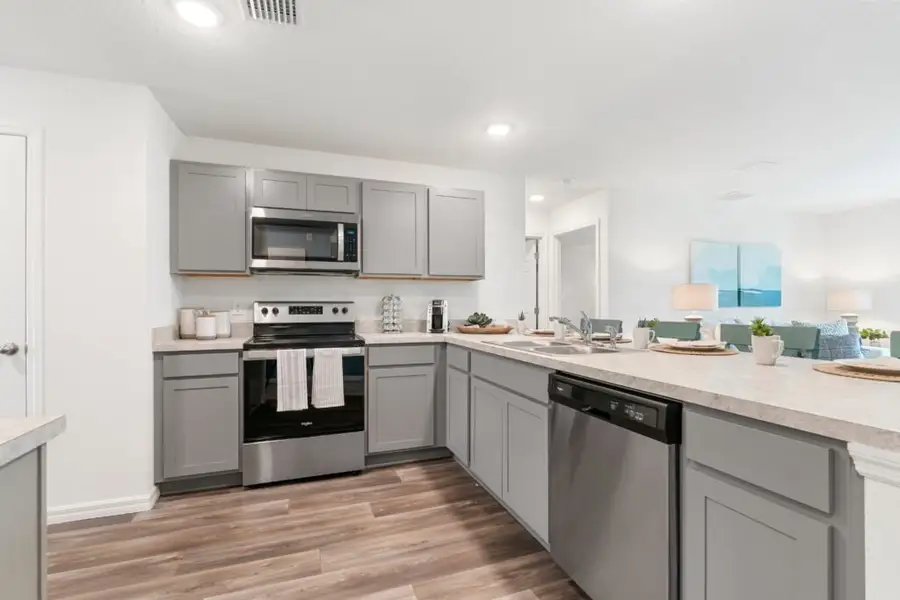 Representative furnished interior of a home built from the Alexander by Holiday Builders in Palm Bay, Palm Bay (Image 6).