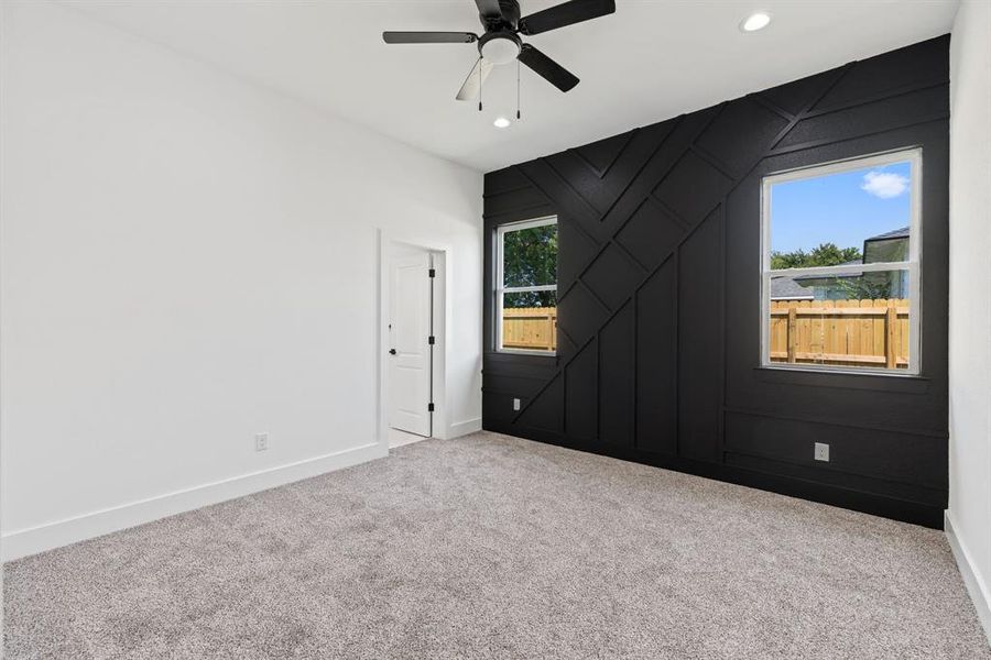 Spare room with carpet floors, ceiling fan, and recessed lighting