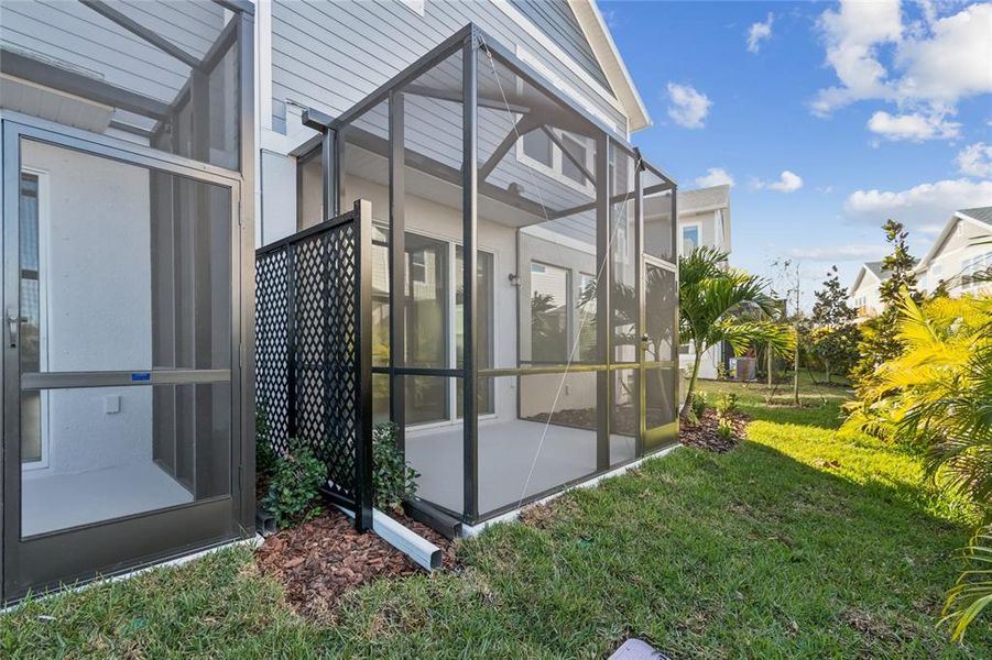 Exterior details and patio area of a home in North River Ranch – Townhomes, Parrish (Image 27).