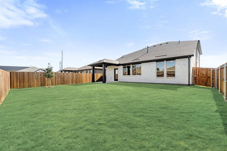 Exterior details and patio area of a home in Bear Creek Elements, Lavon (Image 22).