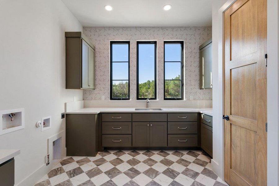 Functional design meets elevated style in the laundry room. Functional design meets elevated style in the laundry room.