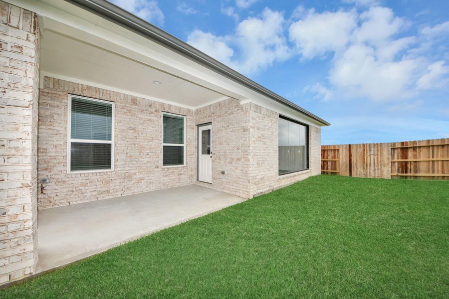 Experience outdoor living at its finest on this expansive covered patio, thoughtfully designed for BBQs and delightful outdoor dining.