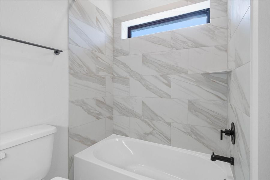 Furnished interior view inside a new home in ARTAVIA, Conroe (Image 8).