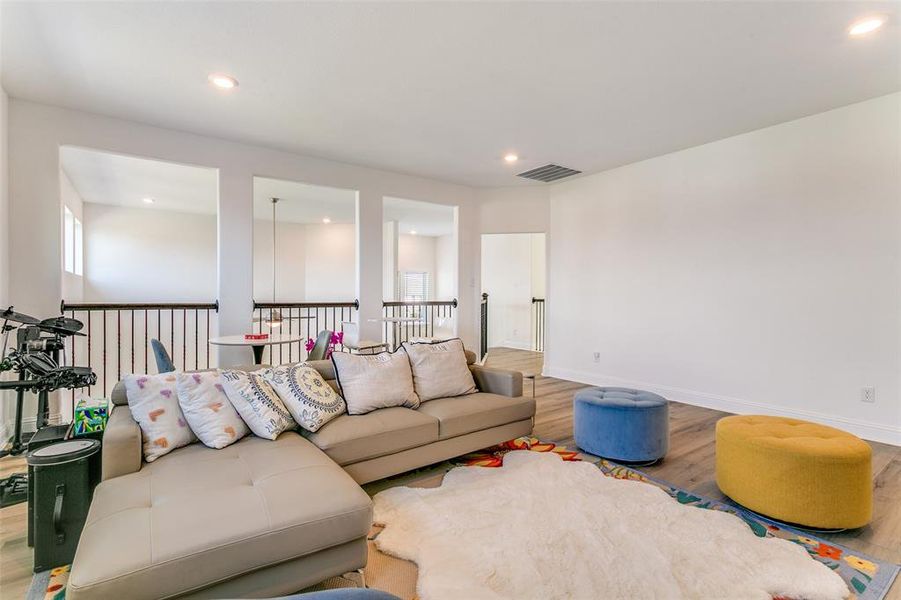 Living area featuring recessed lighting and wood finished floors