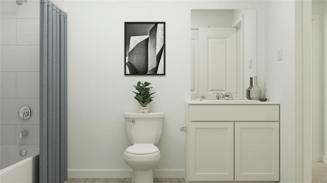 Full bathroom featuring vanity, shower / bath combo, wood-type flooring, and toilet