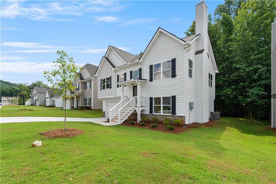 Front exterior of a new home in , Villa Rica, GA, highlighting curb appeal (Image 19). Front exterior of a new home in , Villa Rica, GA, highlighting curb appeal (Image 19).