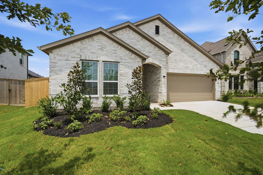 Front exterior of a new home in Ashland, Angleton, TX, highlighting curb appeal (Image 26).