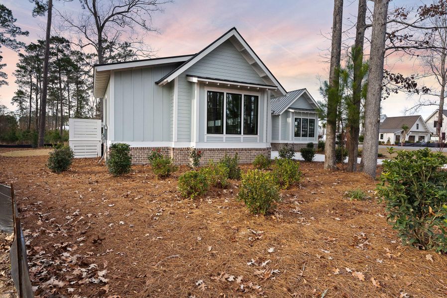 Exterior details and patio area of a home in , Ravenel (Image 38).