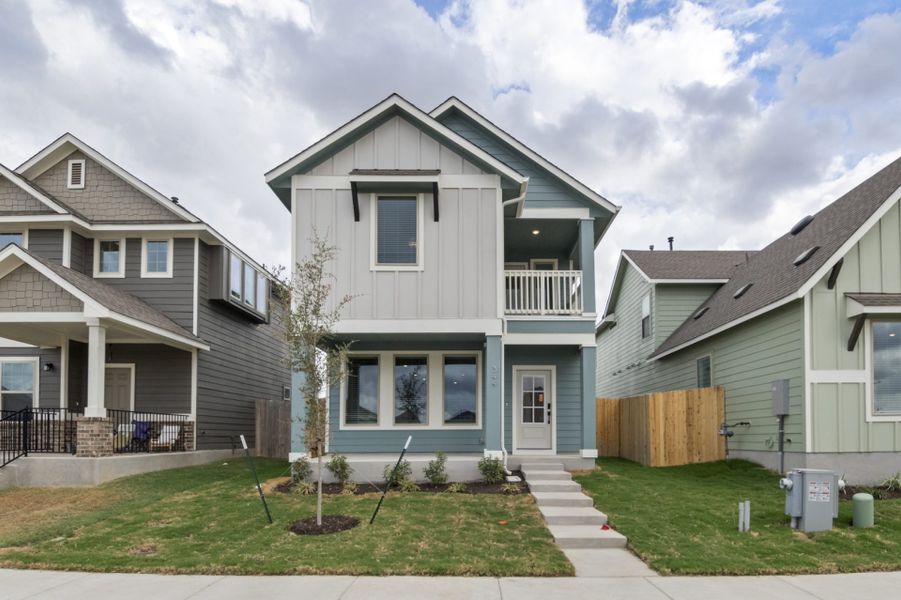 Front exterior of a new home in Blanco Vista, San Marcos, TX, highlighting curb appeal (Image 2). Front exterior of a new home in Blanco Vista, San Marcos, TX, highlighting curb appeal (Image 2).