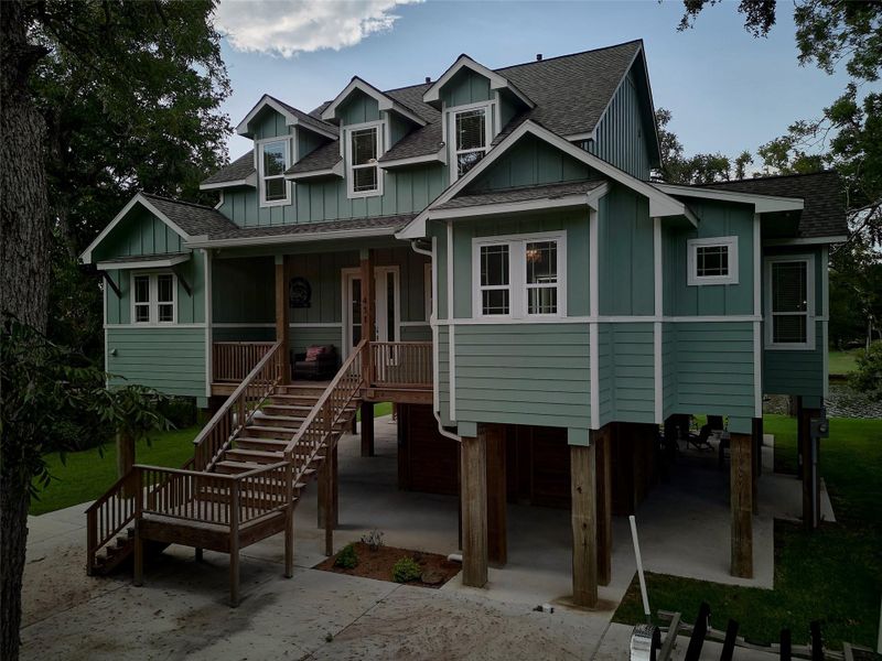 Front exterior of a new home in , Sargent, TX, highlighting curb appeal (Image 2). Front exterior of a new home in , Sargent, TX, highlighting curb appeal (Image 2).