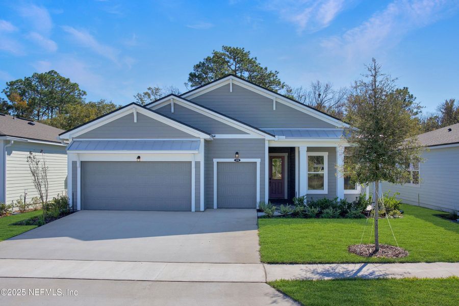 Front exterior of a new home in RiverTown - WaterSong, St. Johns, FL, highlighting curb appeal (Image 17). Front exterior of a new home in RiverTown - WaterSong, St. Johns, FL, highlighting curb appeal (Image 17).