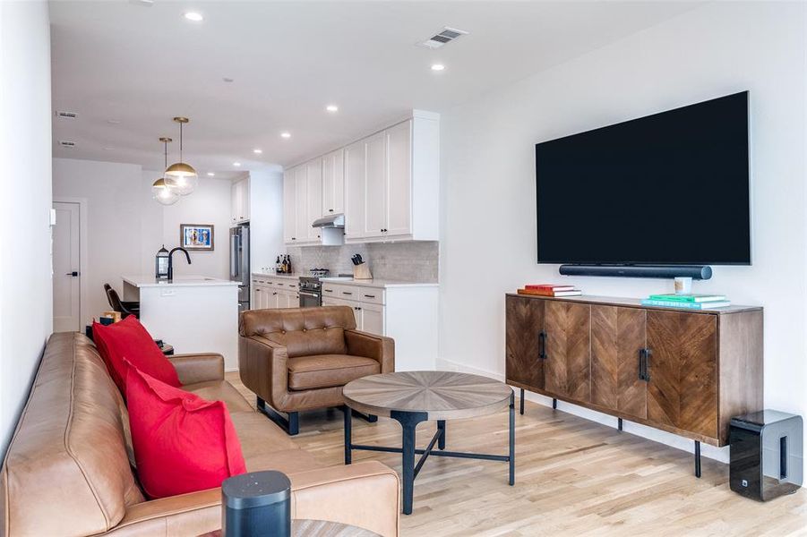 Living area featuring recessed lighting and light wood-style flooring Living area featuring recessed lighting and light wood-style flooring