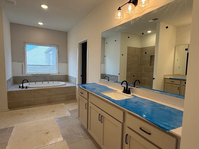 Primary Bath featuring the AW Collection® Artisan - A blend of artisan textures and calm, grounding colors. Primary Bath featuring the AW Collection® Artisan - A blend of artisan textures and calm, grounding colors.