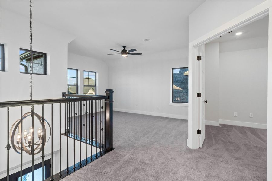 Opposite of the secondary bedrooms area, is this spacious Game Room and adjoining Media Room.