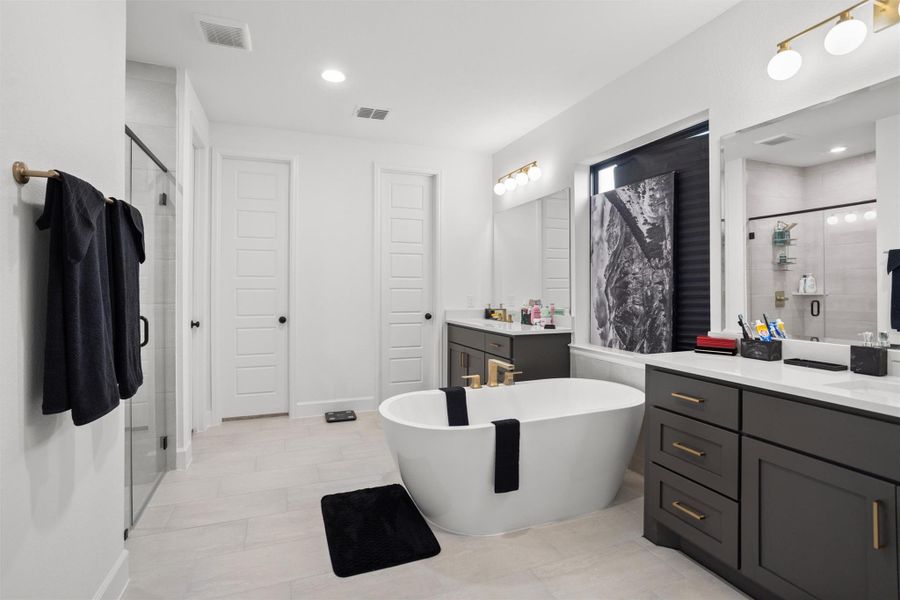 Luxurious primary bath with freestanding tub