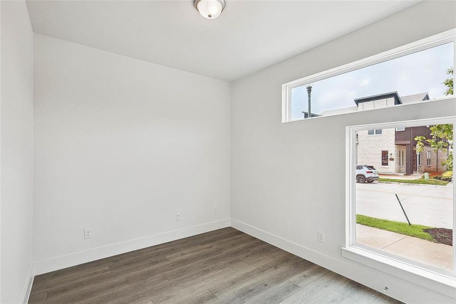 Spare room with wood-type flooring