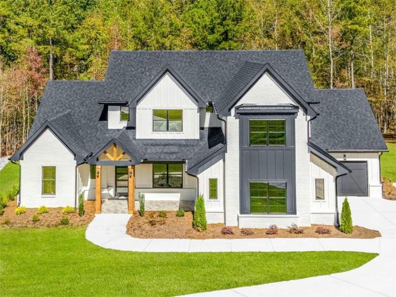 Front exterior of a new home in , Newnan, GA, highlighting curb appeal (Image 2). Front exterior of a new home in , Newnan, GA, highlighting curb appeal (Image 2).