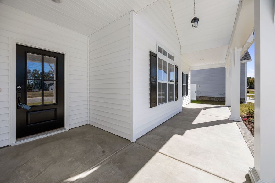 Exterior details and patio area of a home in The Preserve at Langston, Winterville (Image 3).