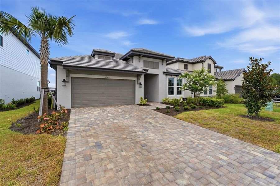 Front exterior of a new home in , Bradenton, FL, highlighting curb appeal (Image 21).