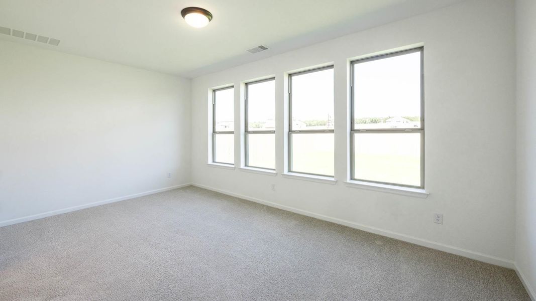 Spacious, unfurnished interior of a new home in Santa Rita Ranch - Tierra Rosa, Liberty Hill (Image 8).