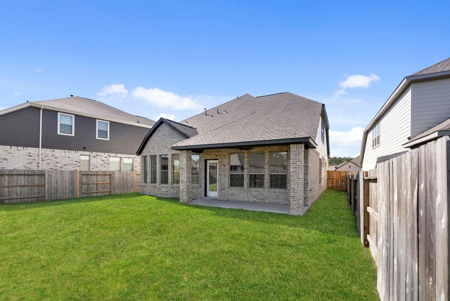 Exterior details and patio area of a home in The Trails 50', New Caney (Image 22).