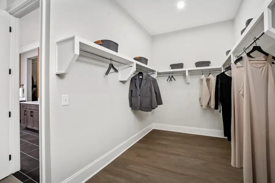 The Belvidere Primary Walkin Closet The Belvidere Primary Walkin Closet
