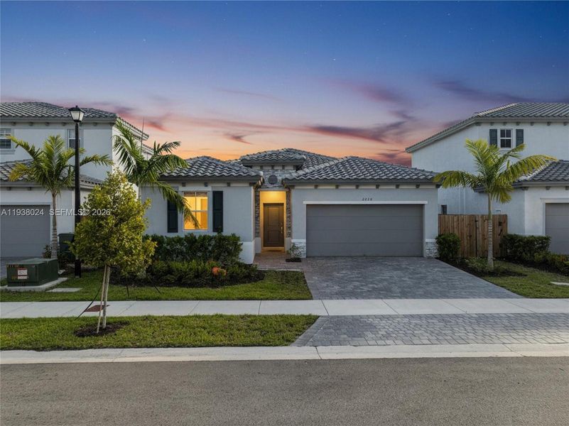 Front exterior of a new home in , Homestead, FL, highlighting curb appeal (Image 1). Front exterior of a new home in , Homestead, FL, highlighting curb appeal (Image 1).