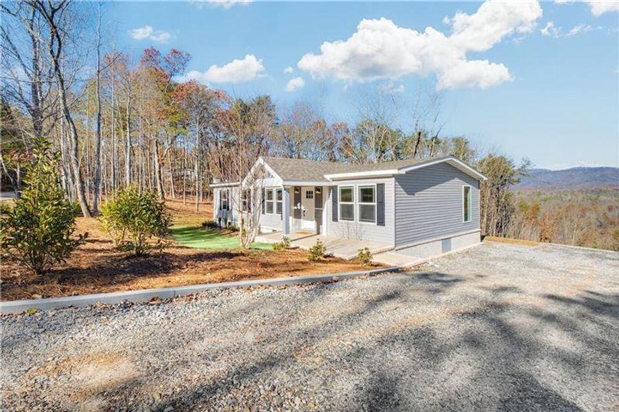 Front exterior of a new home in , Ball Ground, GA, highlighting curb appeal (Image 22).