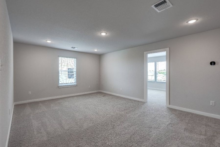 A room with a door and windows.