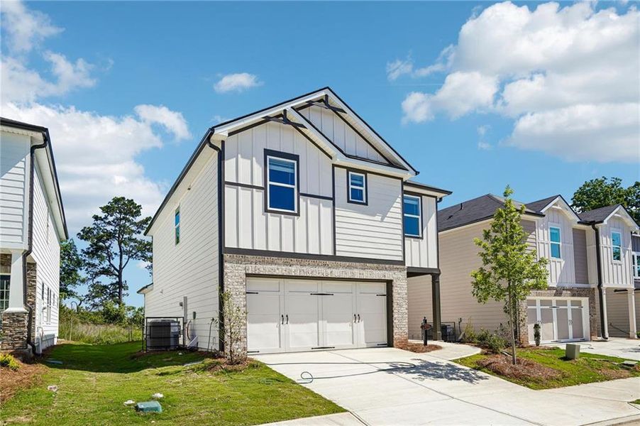 Front exterior of a new home in Hawthorne Station, College Park, GA, highlighting curb appeal (Image 23).