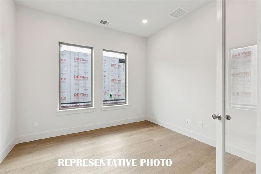 The professional working from home will appreciate this private, light filled home office.  REPRESENTATIVE PHOTO