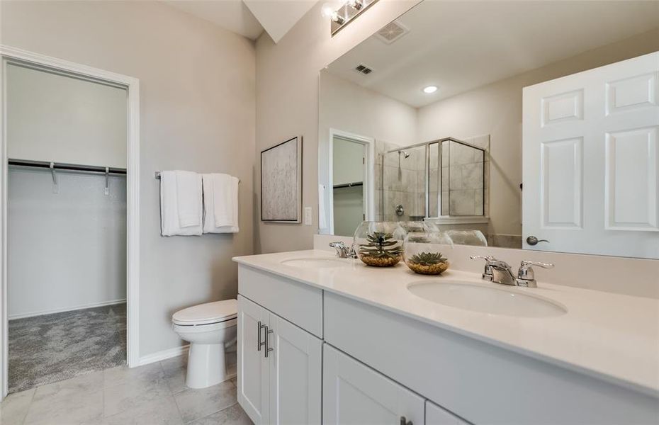 *Model Representation - Spacious owner's suite with private bath